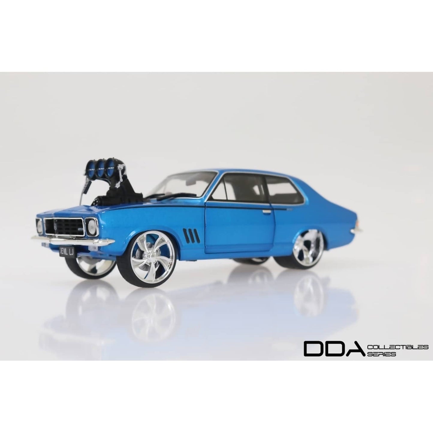DDA Collectibles -  1:24 Scale - Metallic Blue Evil LJ 1973 Holden LJ Torana - Diecast Model