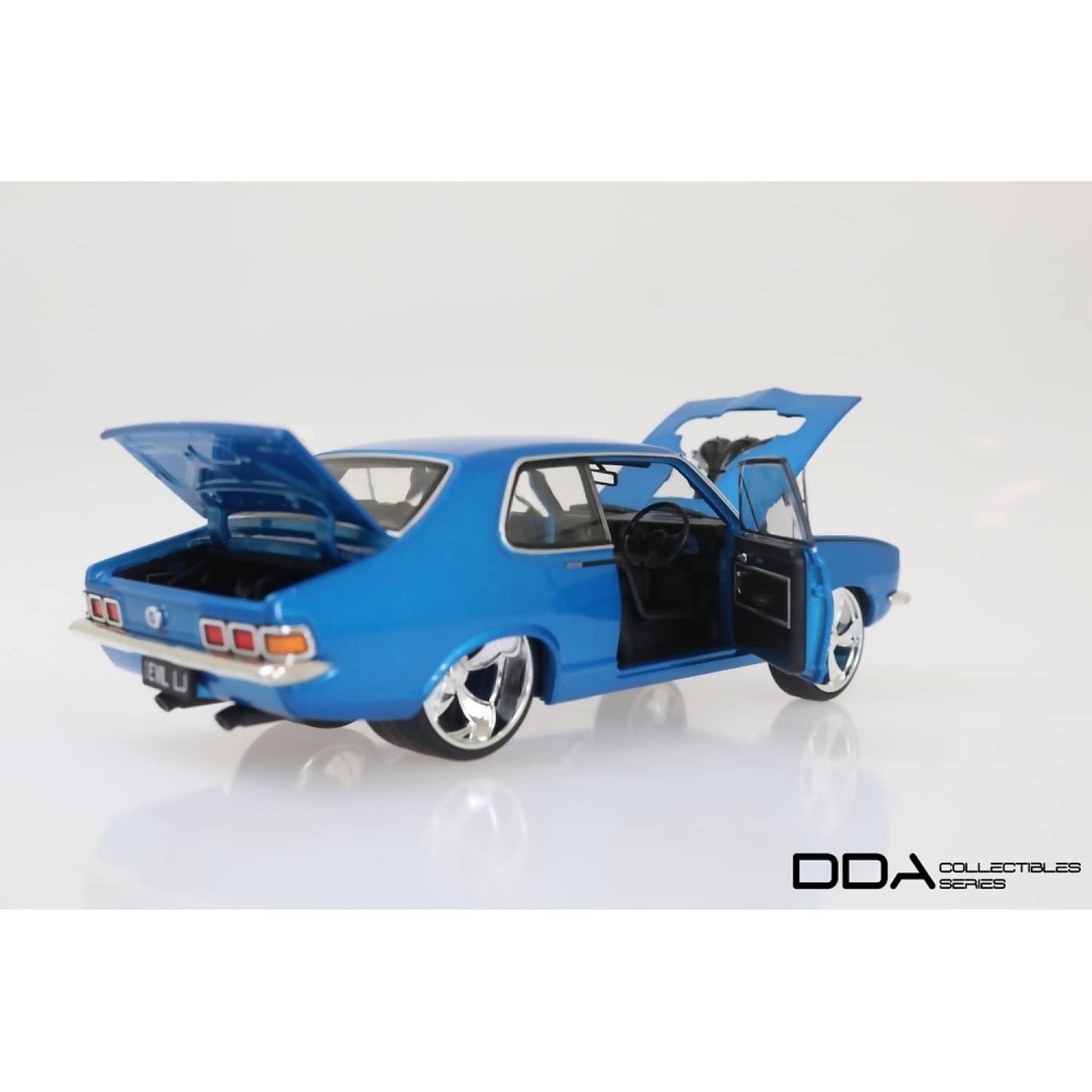 DDA Collectibles -  1:24 Scale - Metallic Blue Evil LJ 1973 Holden LJ Torana - Diecast Model