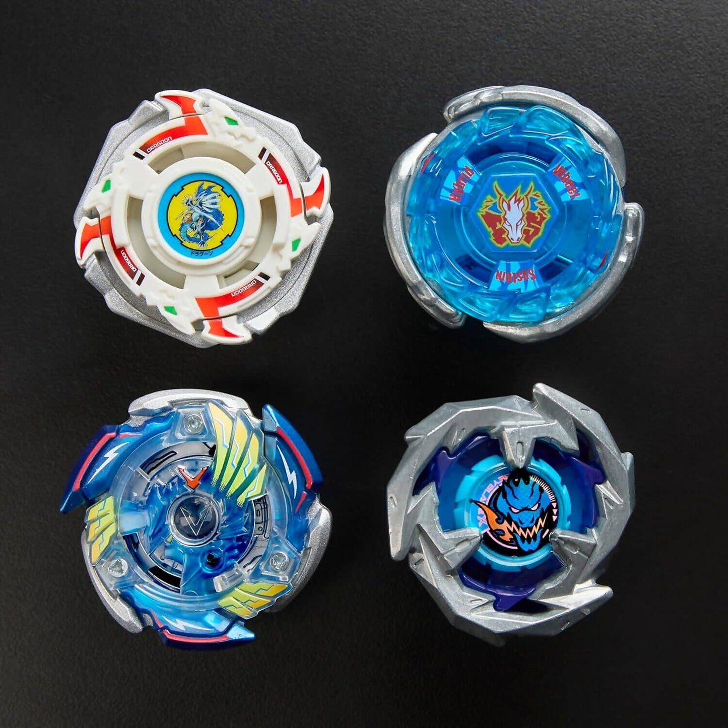 Beyblade -  X - 25th Anniversary Set History 1999 - 2024 Includes 4 Takara Tomy Tops and 4 Launchers